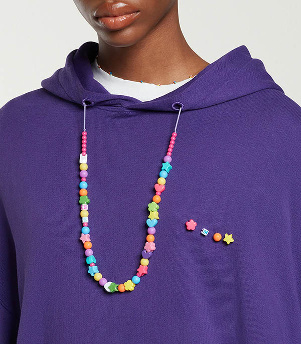 Violet Mira Mikati hoodie with pearl necklace