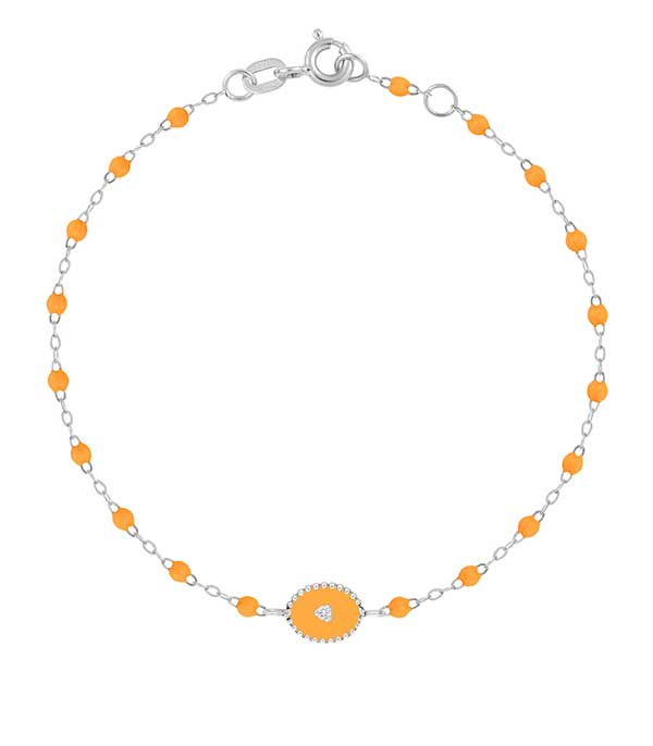 Bracelet or gris, perles de résine et médaille étoile du nord Gigi Clozeau
